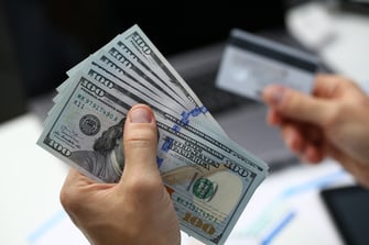 male-hand-holds-dollar-banknotes--2